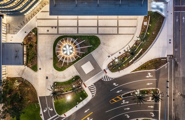 Star like concrete plaza entry sculpture.