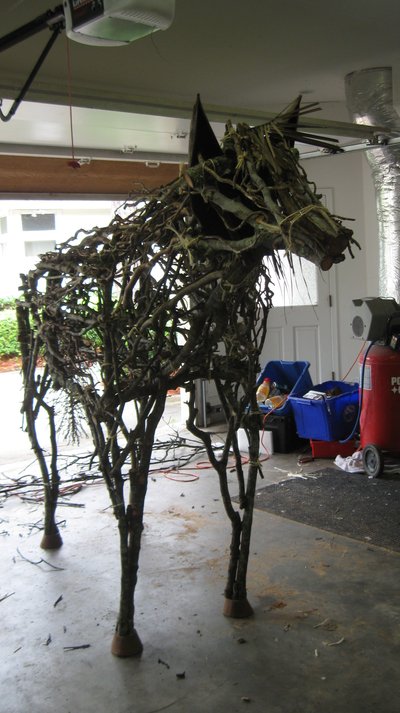 The lifesize stylized stick horse sculpture in the garage where it was built.