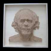 Laminated wood relief self-portrait.