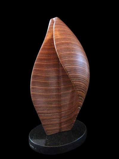 Laminated wood sculpture that curves in on itself from the right size.