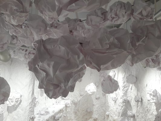 "Boulders" of paper hang from the ceiling.