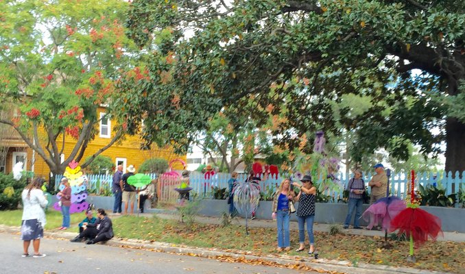 People enjoying a collection of pop-up sculptures