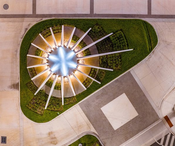 Star like concrete plaza entry sculpture.