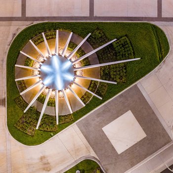 Star like concrete plaza entry sculpture.